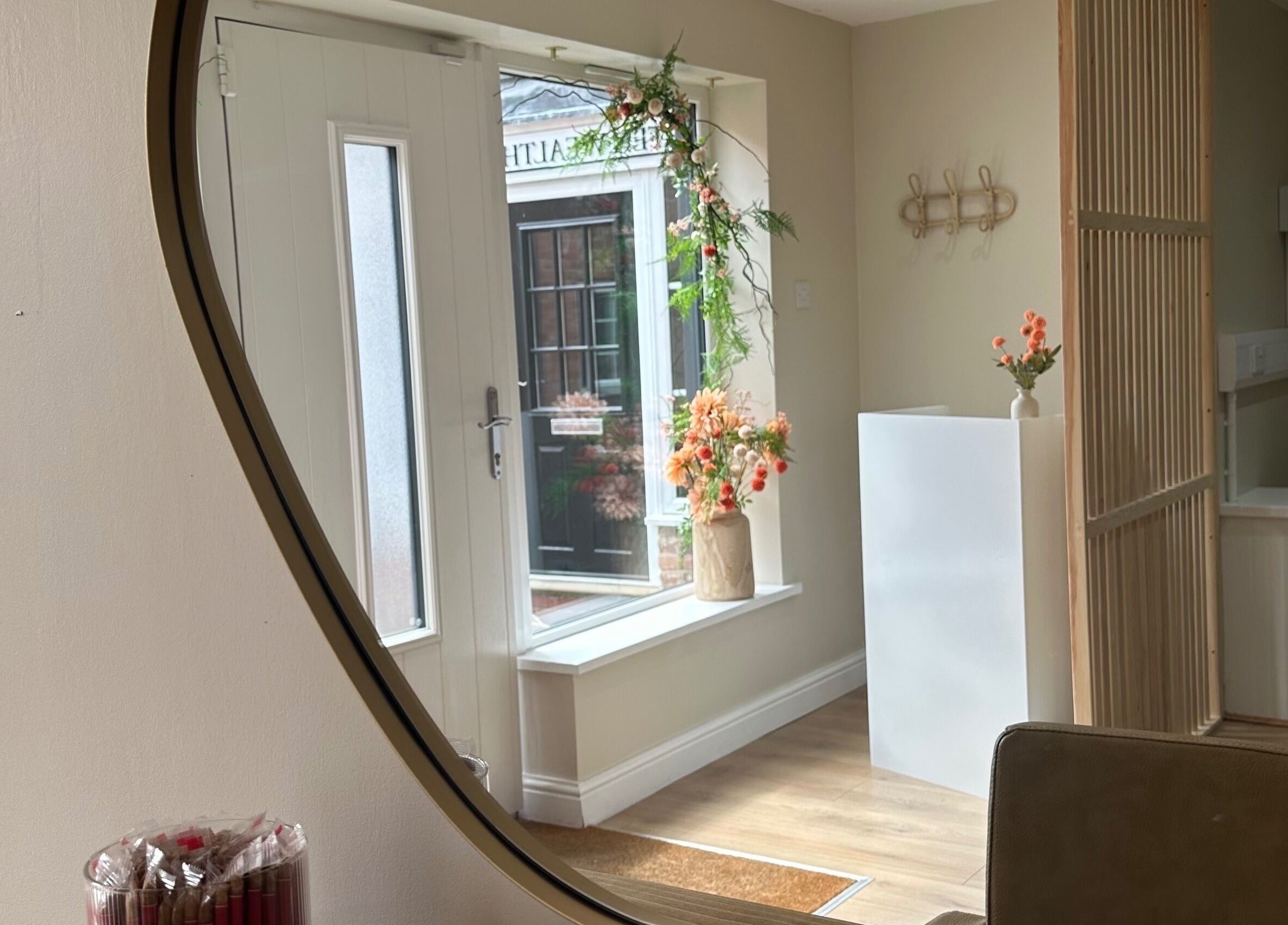 Inviting entryway of Faith & Co. in Epworth, England, GB, featuring floral decor and warm wooden accents.