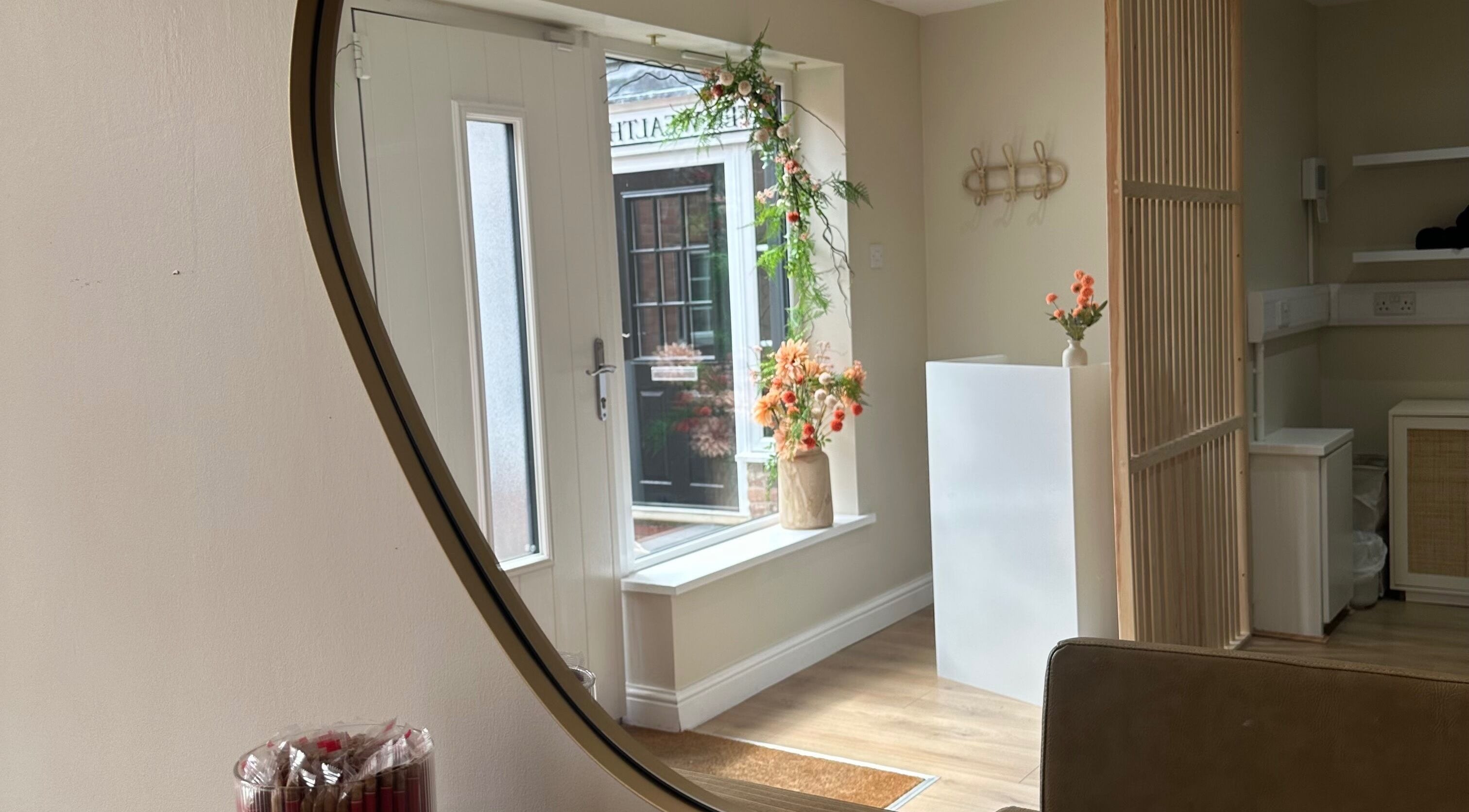 Inviting entryway of Faith & Co. in Epworth, England, GB, featuring floral decor and warm wooden accents.
