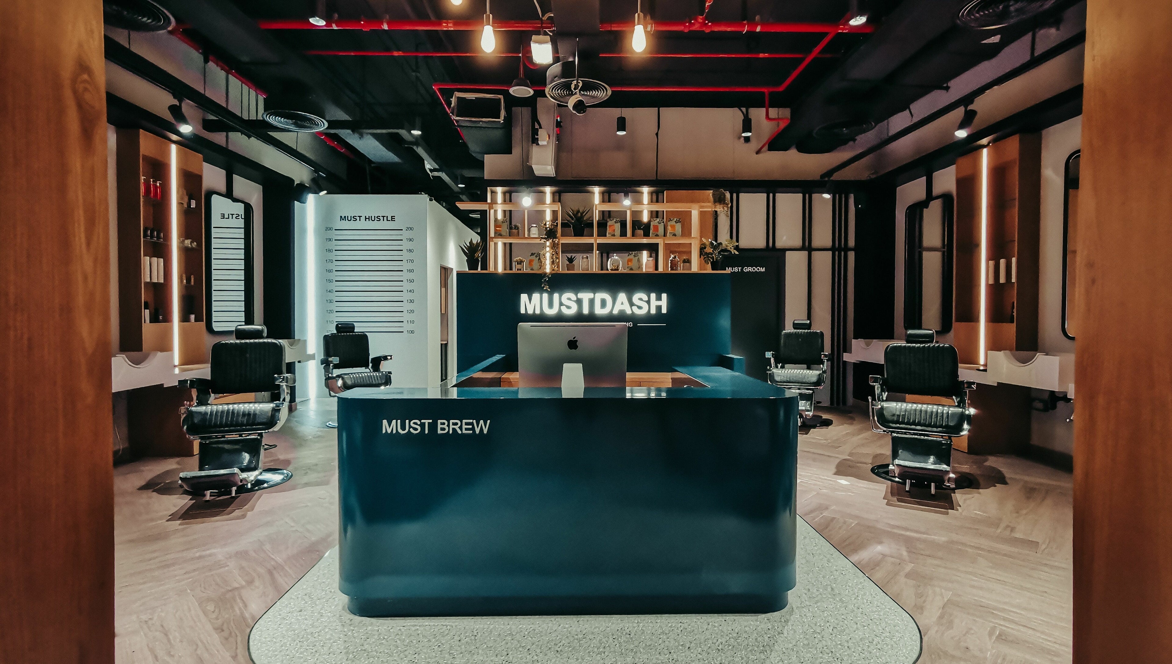 Luxurious interior of Must Dash - Bespoke Men’s Grooming in Dubai, AE, showcasing modern styling chairs.