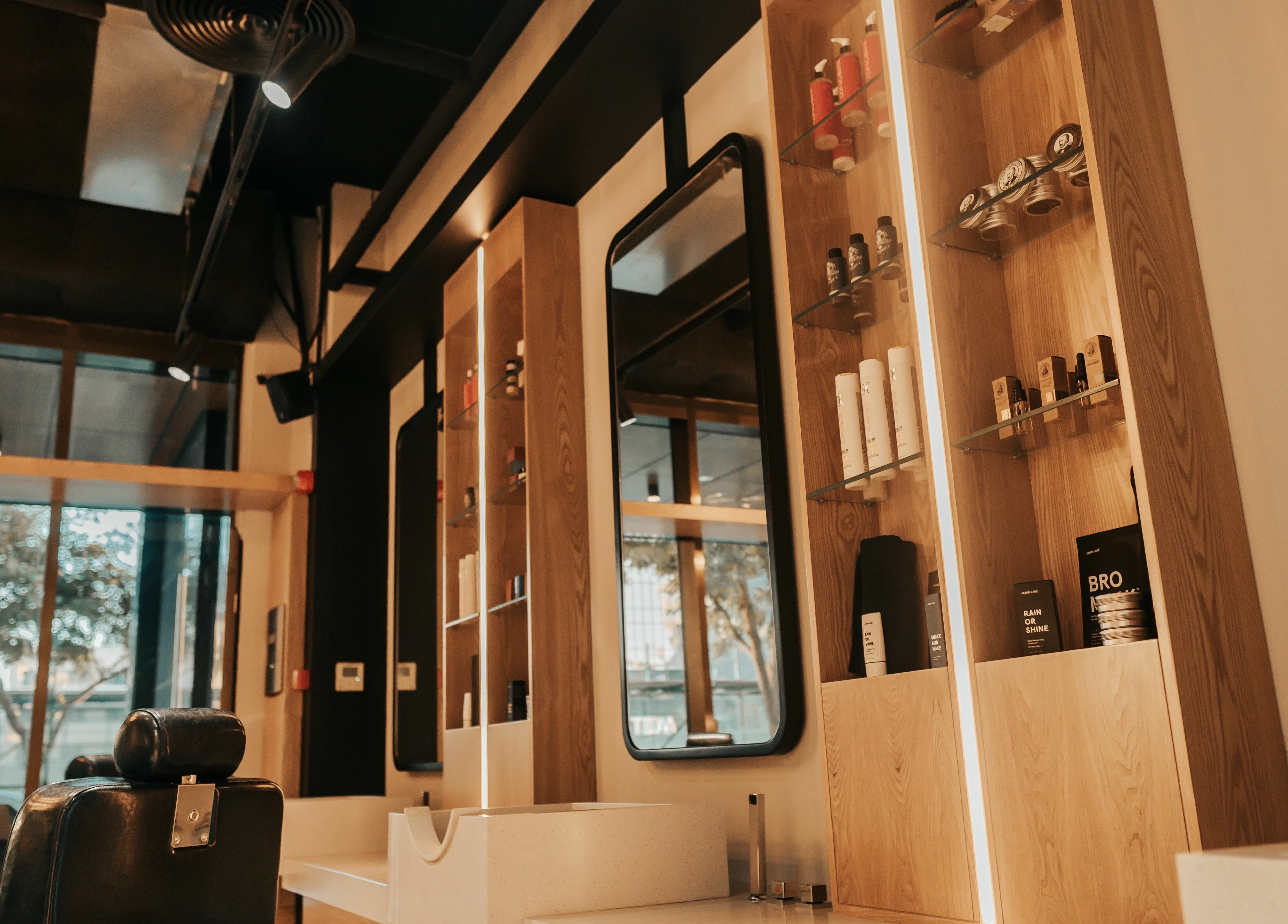 Interior of Must Dash - Bespoke Men’s Grooming, Dubai, AE, showcasing elegant salon setup.