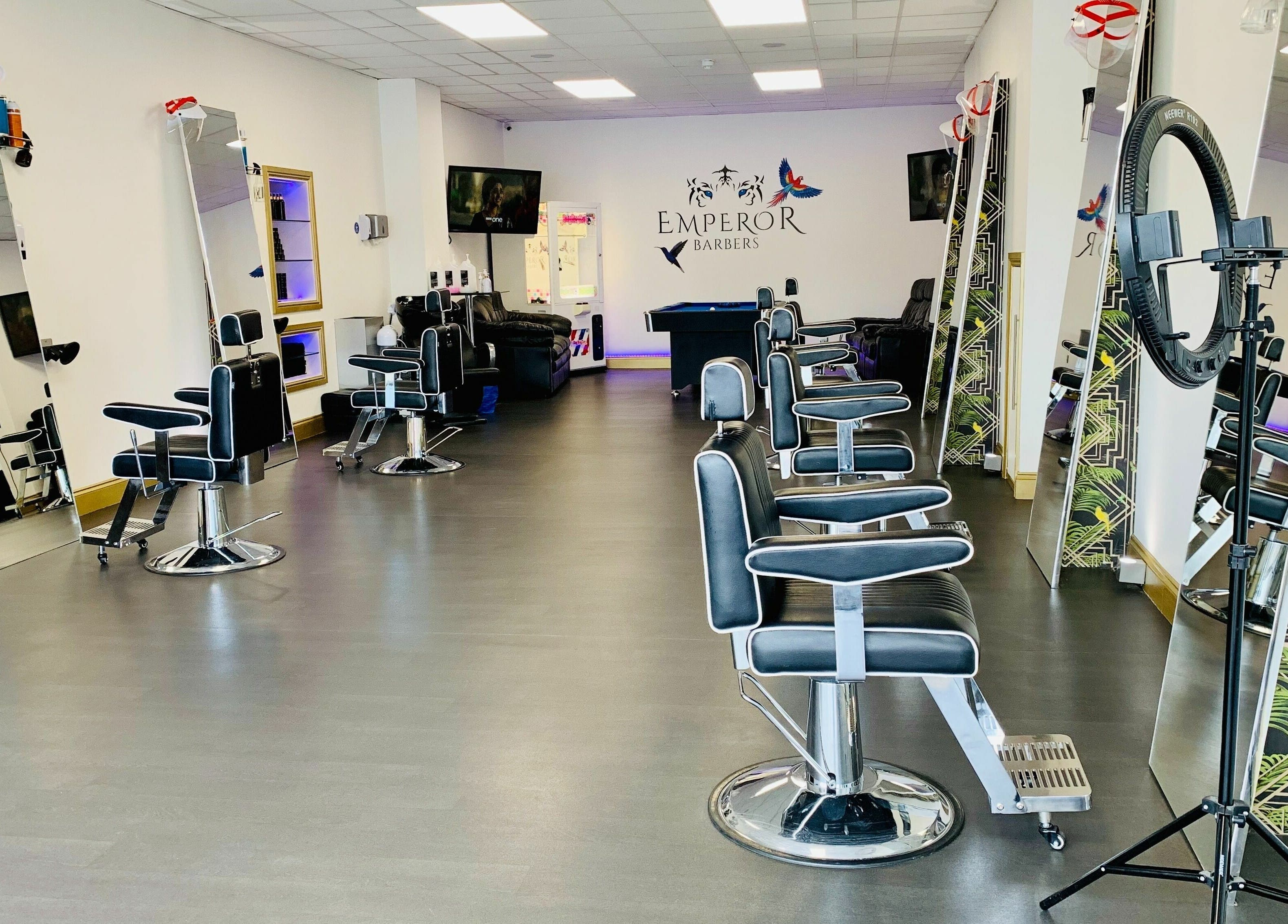 Modern barber chairs and mirrors at Emperor Barbers, Dunstable, England, GB offering premium grooming.