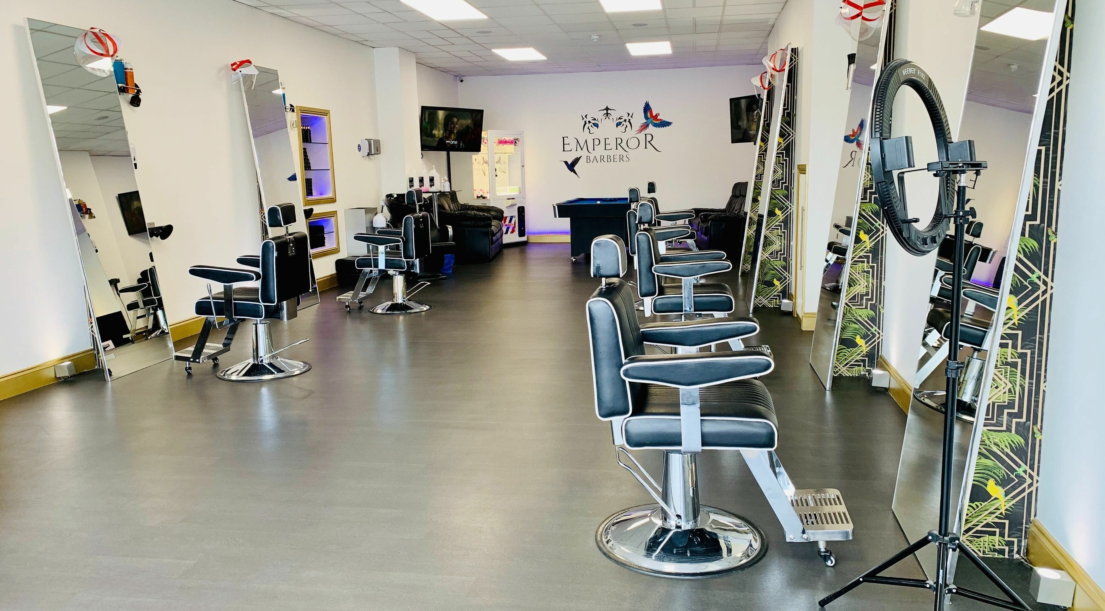 Modern barber chairs and mirrors at Emperor Barbers, Dunstable, England, GB offering premium grooming.