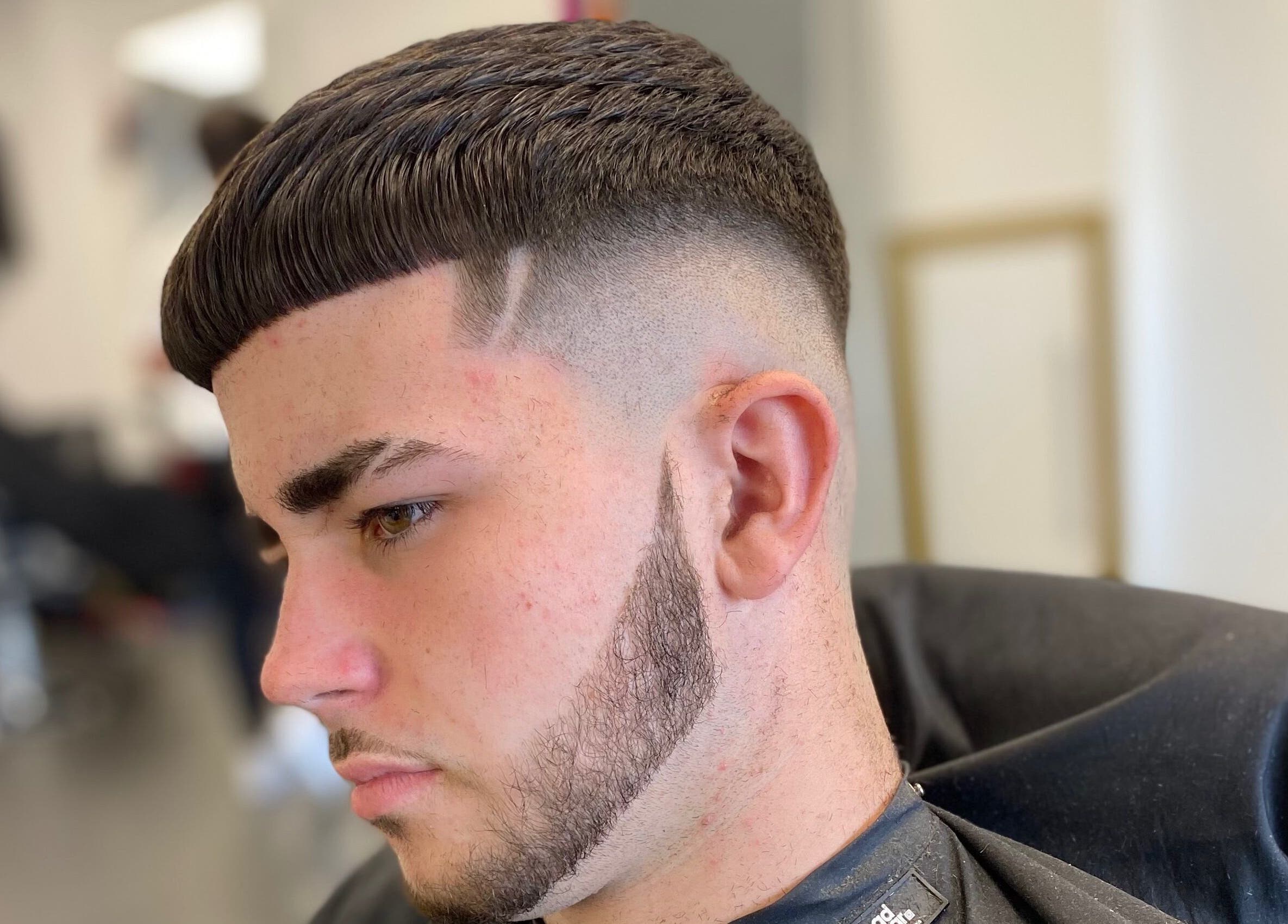 Sharp haircut detail at Emperor Barbers, Dunstable, England, GB, showcasing expert styling and precision.