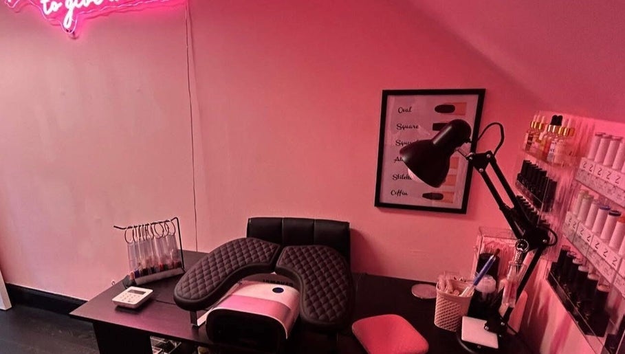 A stylish nail station at The Luxury Nail Bar, Tweedbank, Scotland, GB, featuring tools and vibrant nail colors.