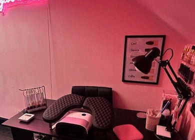 A stylish nail station at The Luxury Nail Bar, Tweedbank, Scotland, GB, featuring tools and vibrant nail colors.