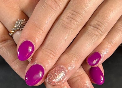 Vibrant purple manicure with glitter detail at The Luxury Nail Bar, Tweedbank, Scotland, GB.