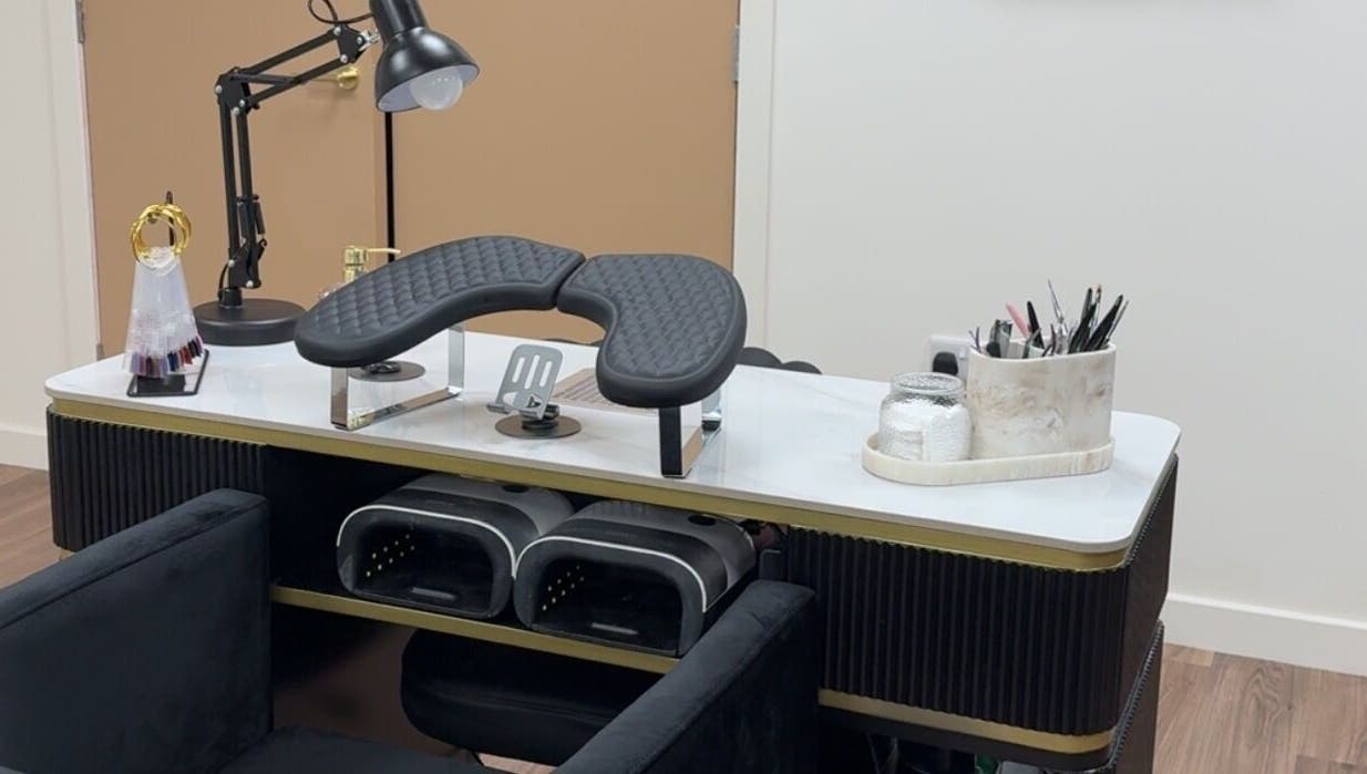Modern nail station at The Luxury Nail Bar, Galashiels, Scotland, GB, showcasing tools and comfortable seating.