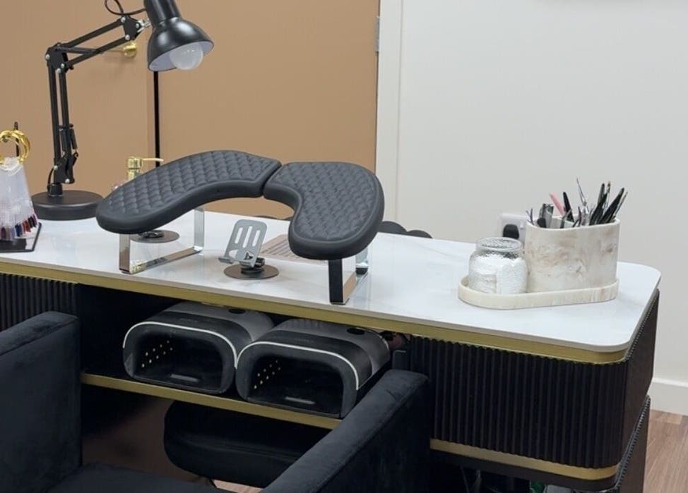 Modern nail station at The Luxury Nail Bar, Galashiels, Scotland, GB, showcasing tools and comfortable seating.
