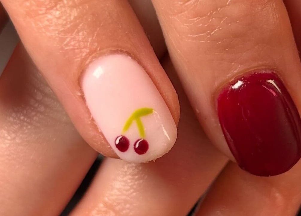 Cherry nail art at The Luxury Nail Bar in Galashiels, Scotland, GB. Vibrant and chic manicure.