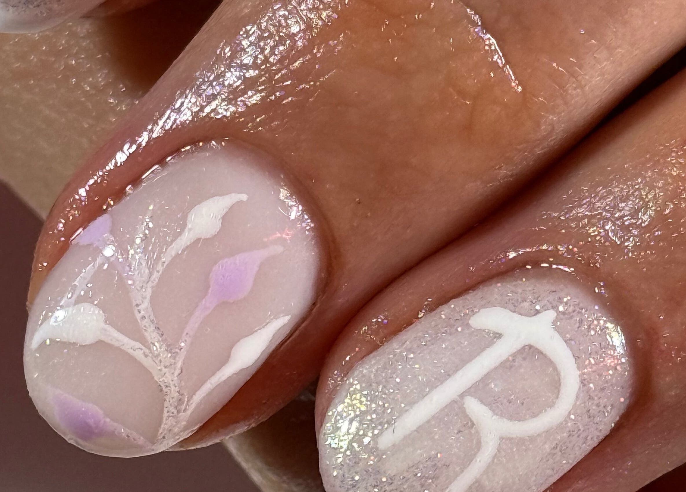Elegant nail art at The Luxury Nail Bar in Galashiels, Scotland, GB showcasing delicate white designs.