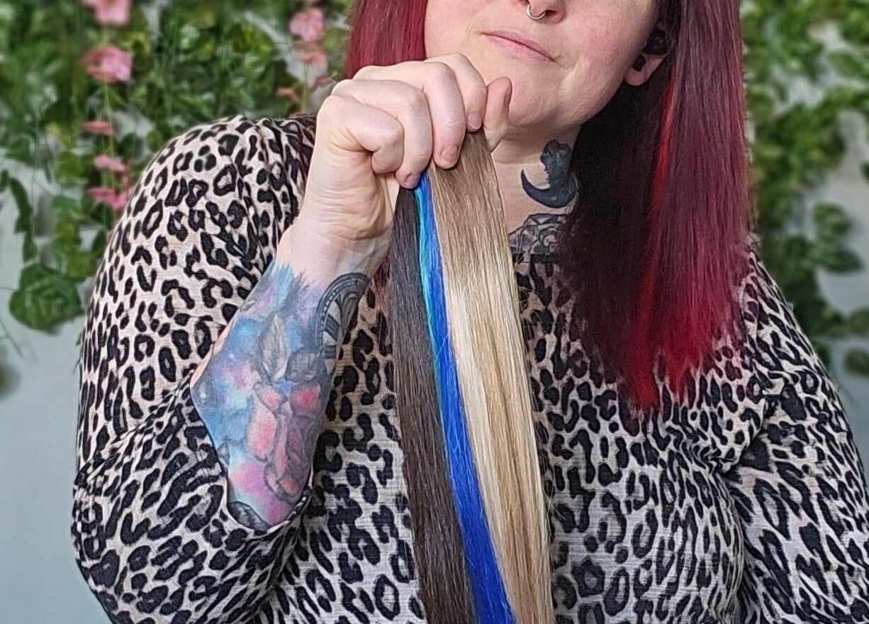 Bold hair colors showcased at Balanced Hair in Dieppe, New Brunswick, CA, featuring vivid blue highlights.