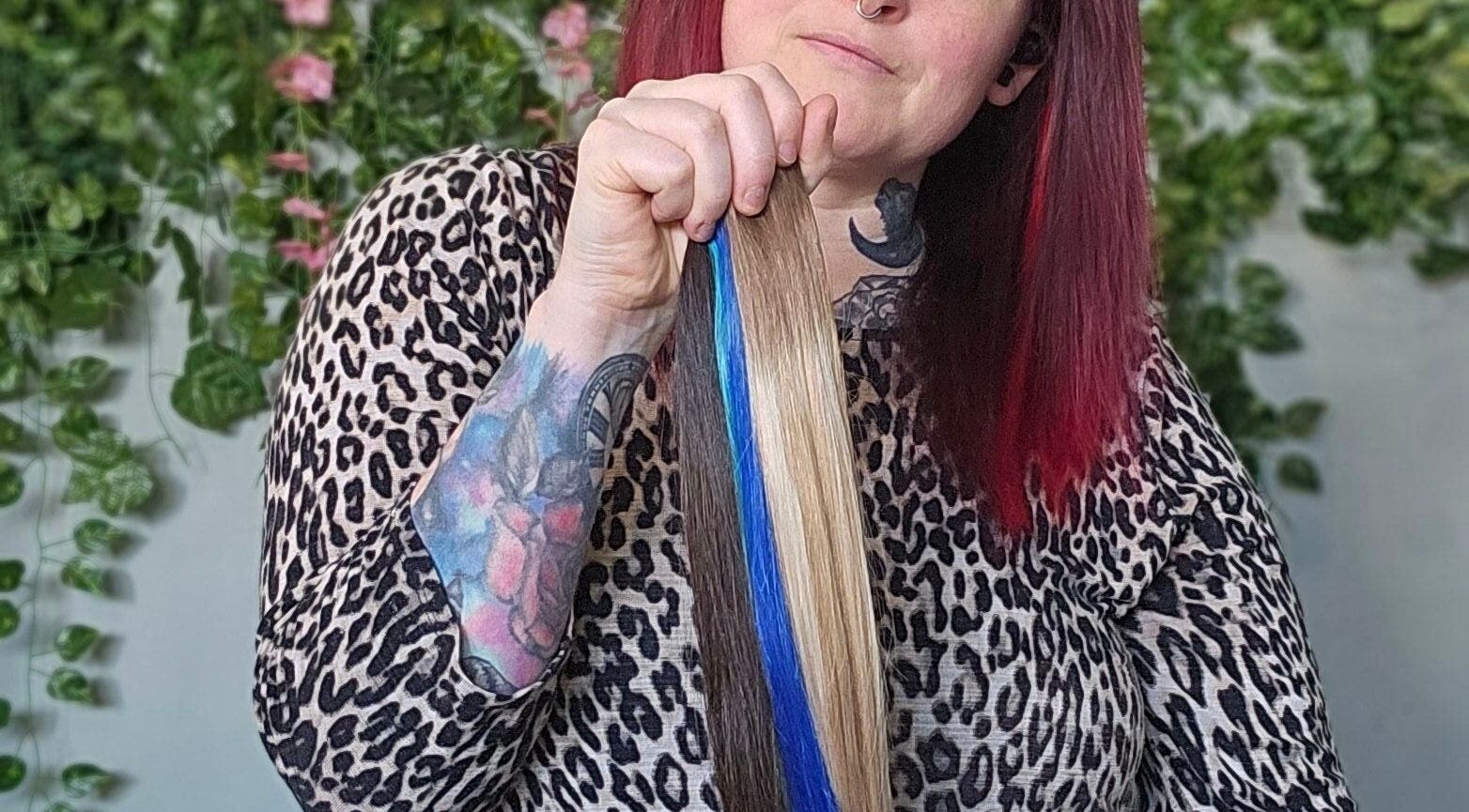 Bold hair colors showcased at Balanced Hair in Dieppe, New Brunswick, CA, featuring vivid blue highlights.