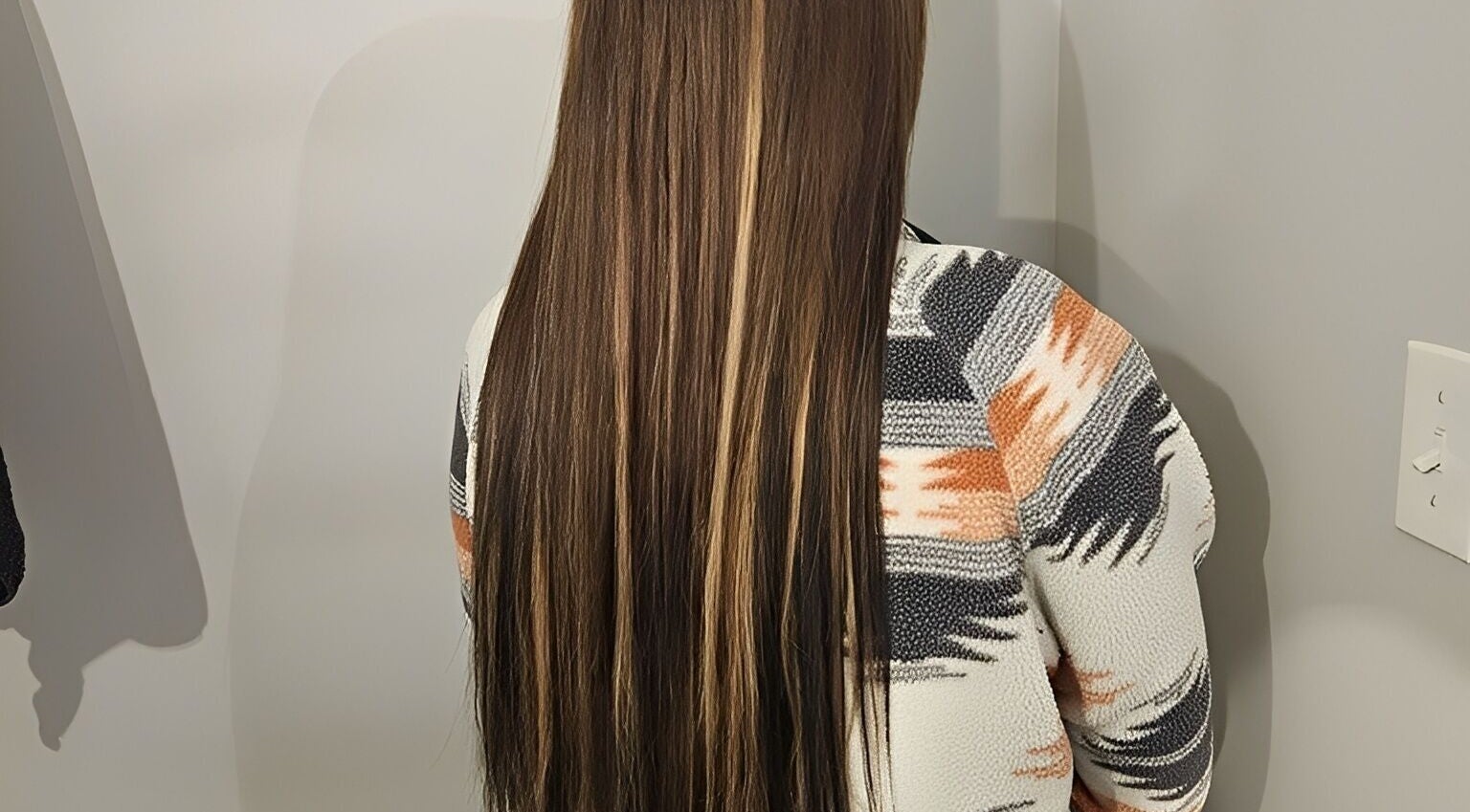 Long, highlighted hair at Balanced Hair, Dieppe, New Brunswick, CA salon.