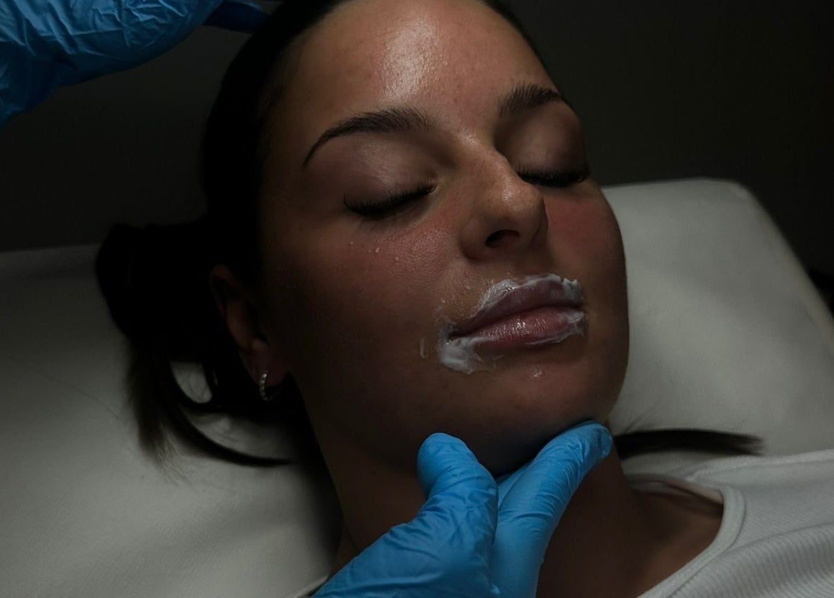 Facial procedure at Ines Medics, Grantham, England, GB. Woman receives skincare treatment.