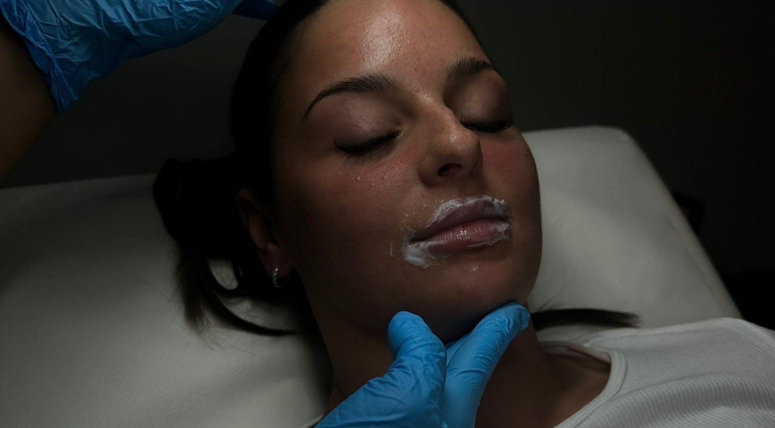 Facial procedure at Ines Medics, Grantham, England, GB. Woman receives skincare treatment.