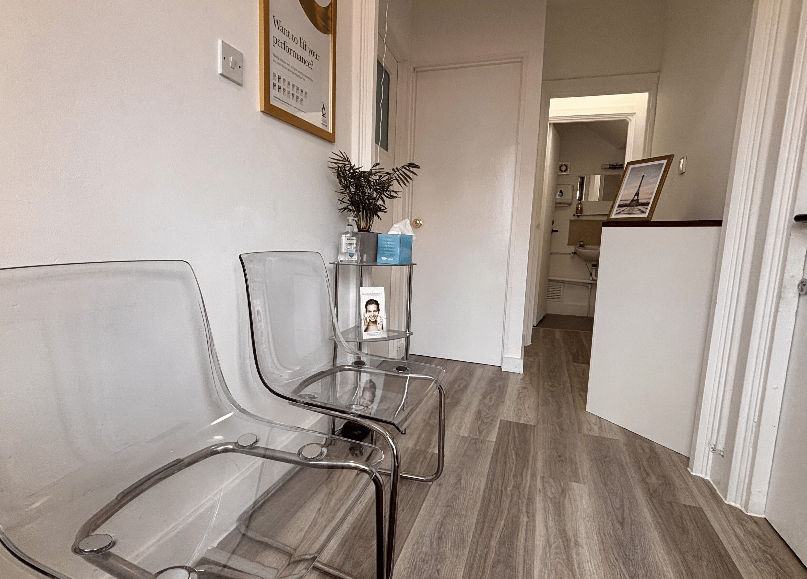 Modern waiting area with clear chairs at Osteotherapy Lab, London, England, GB showcasing sleek design.