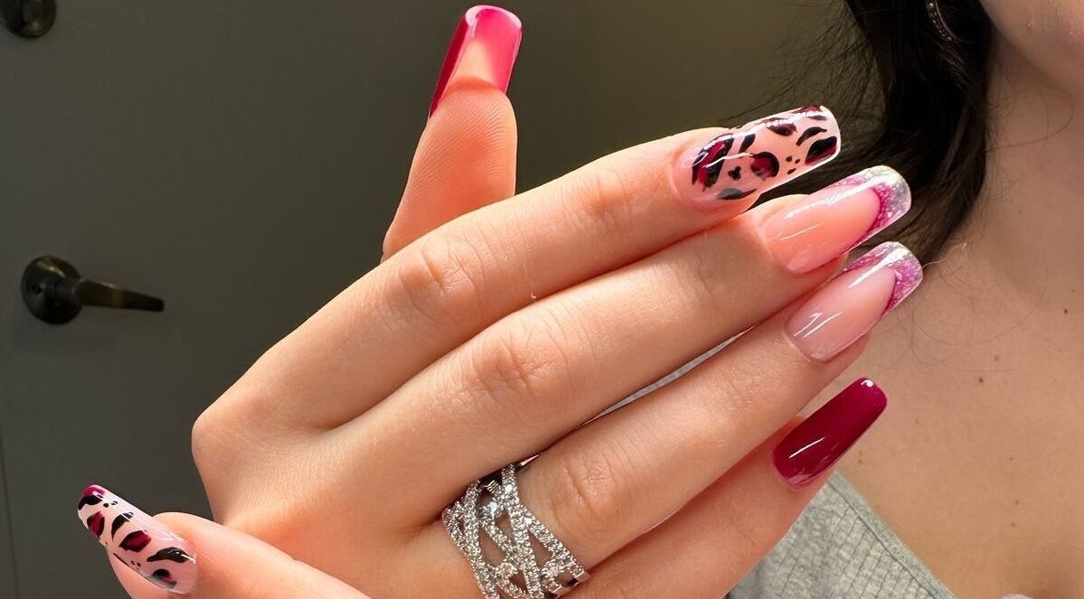 Stylish nail art with glitter and patterns at DIELLANAILS in Toronto, Ontario, CA.