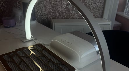 Elegant nail station at GHB Beauty, Great Wyrley, England, GB, featuring a modern lamp and equipment.