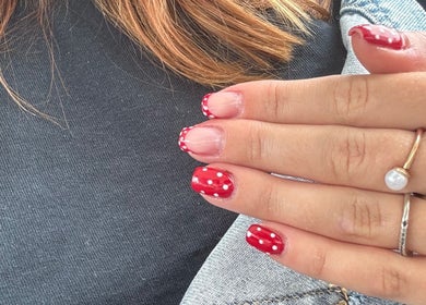 Red polka dot nails from GHB Beauty in Great Wyrley, England, GB, showcasing creative manicure art.