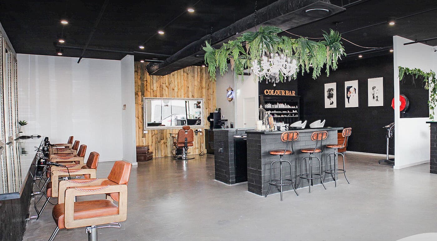 Pose Hair Sydney salon interior in Belmore, New South Wales, featuring stylish seating and a color bar.