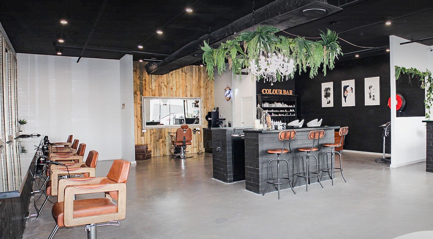 Pose Hair Sydney salon interior in Belmore, New South Wales, featuring stylish seating and a color bar.