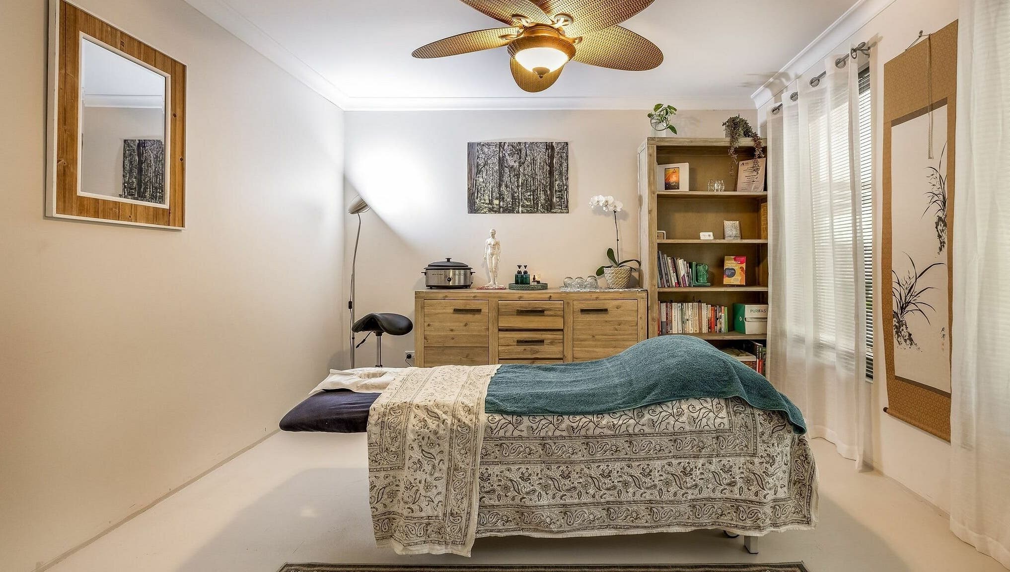 Serene massage room at Dharma Massage & Movement (for Women only), Abbey, Western Australia, AU, with cozy decor.