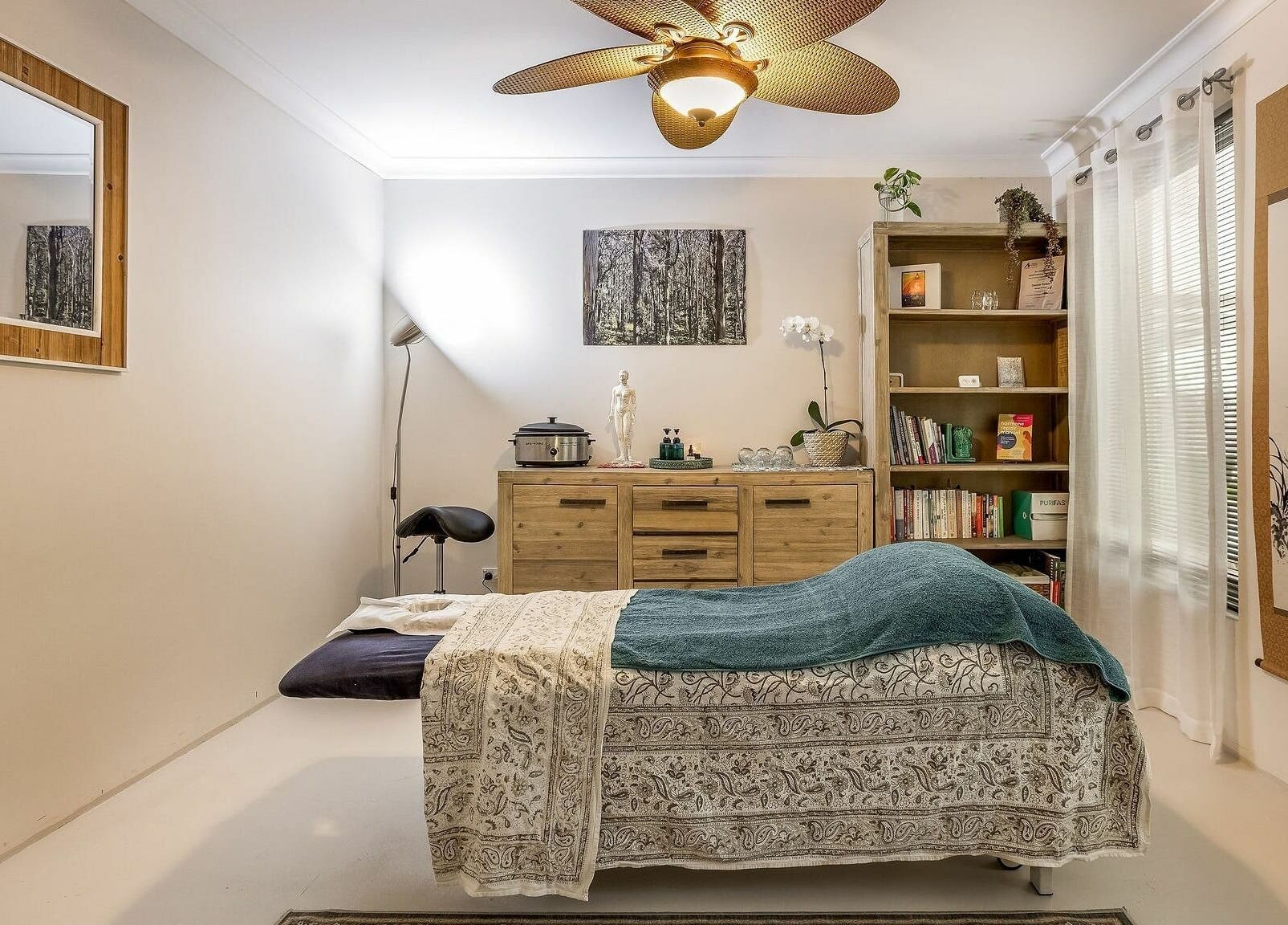 Serene massage room at Dharma Massage & Movement (for Women only), Abbey, Western Australia, AU, with cozy decor.