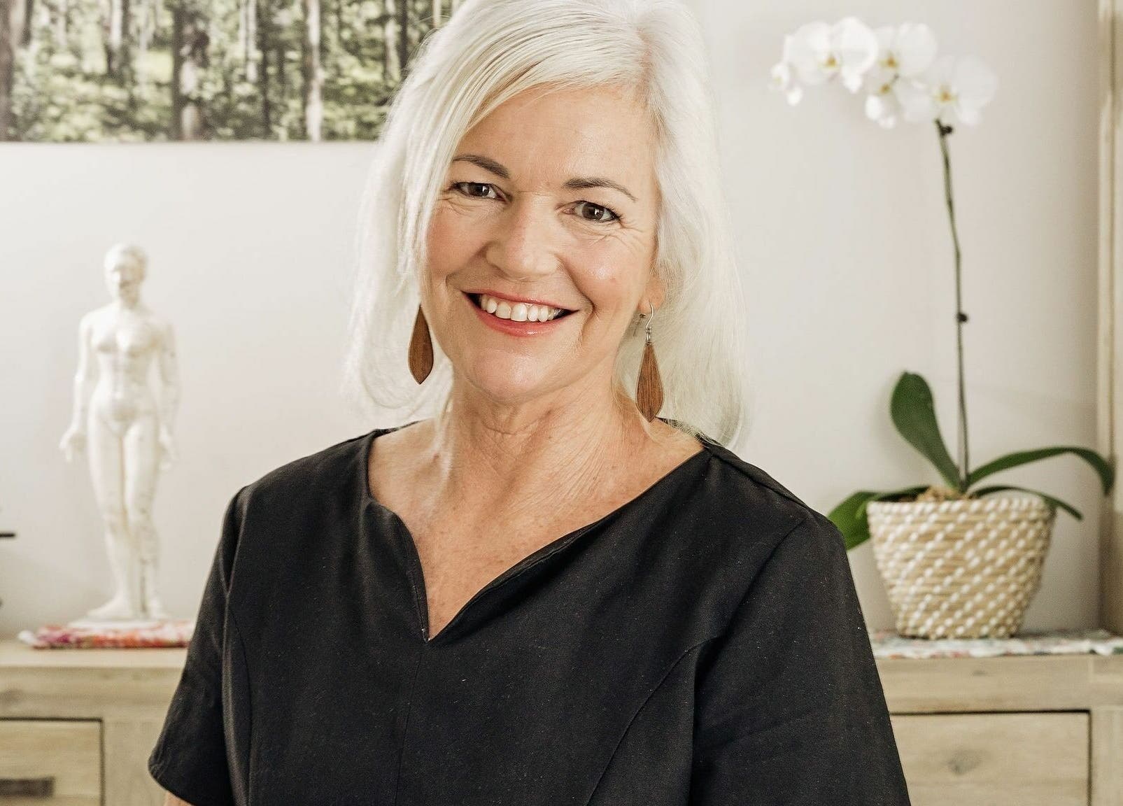 Smiling woman at Dharma Massage & Movement for Women only, Abbey, Western Australia, AU. Elegant wellness setting.