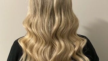 Blonde wavy hair extensions at Katie Brady Hair Extensions, Smiths Falls, Ontario, CA.