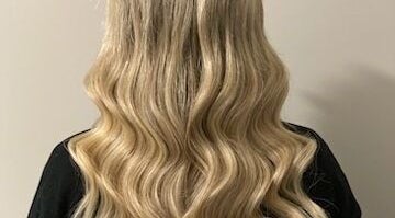 Blonde wavy hair extensions at Katie Brady Hair Extensions, Smiths Falls, Ontario, CA.
