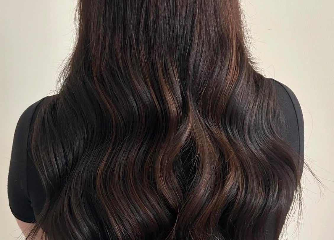 Luscious hair extensions at Katie Brady Hair Extensions, Smiths Falls, Ontario, CA, showcasing glossy waves.