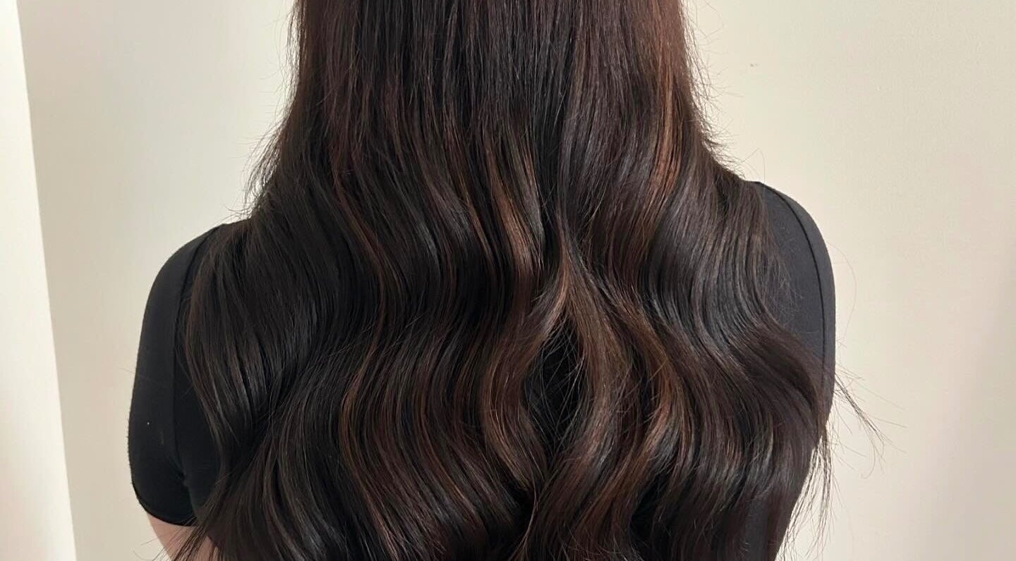 Luscious hair extensions at Katie Brady Hair Extensions, Smiths Falls, Ontario, CA, showcasing glossy waves.