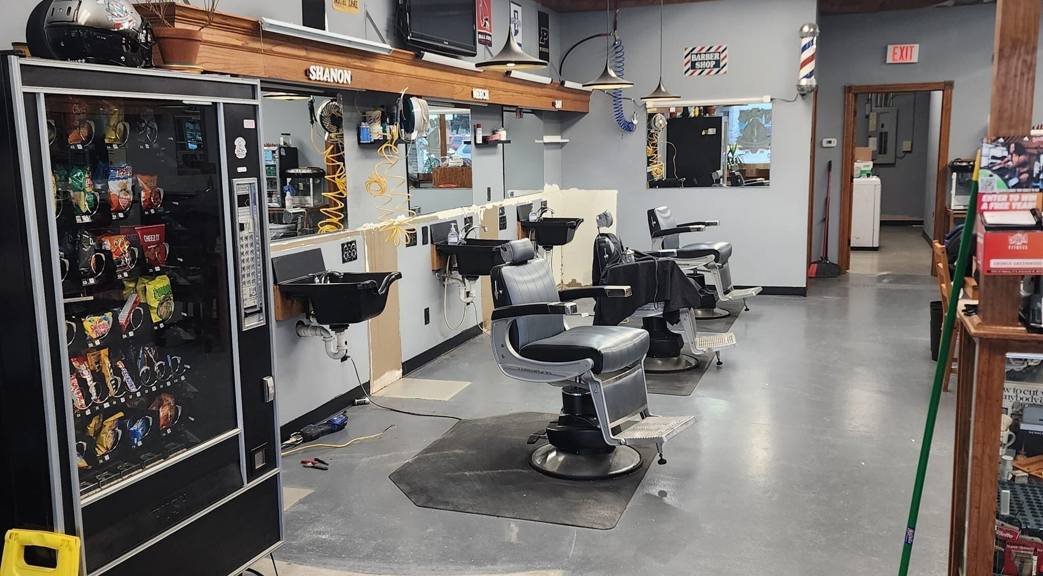 Interior of Mike's Traditional Barbershop, showcasing vintage chairs and equipment in Indianapolis, Indiana, US.