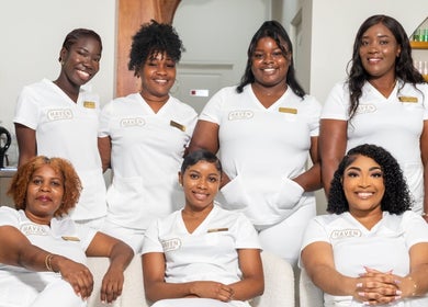 Haven Beauty House staff in uniform smiling at Kingston, St. Andrew Parish, JM venue.
