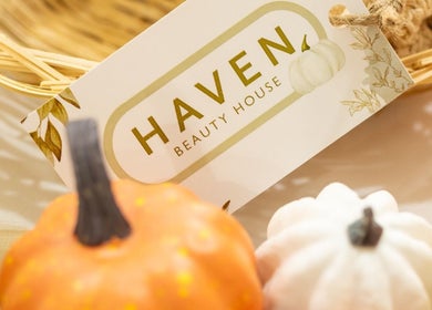 Autumn decor with pumpkins and Haven Beauty House card in Kingston, St. Andrew Parish, JM.