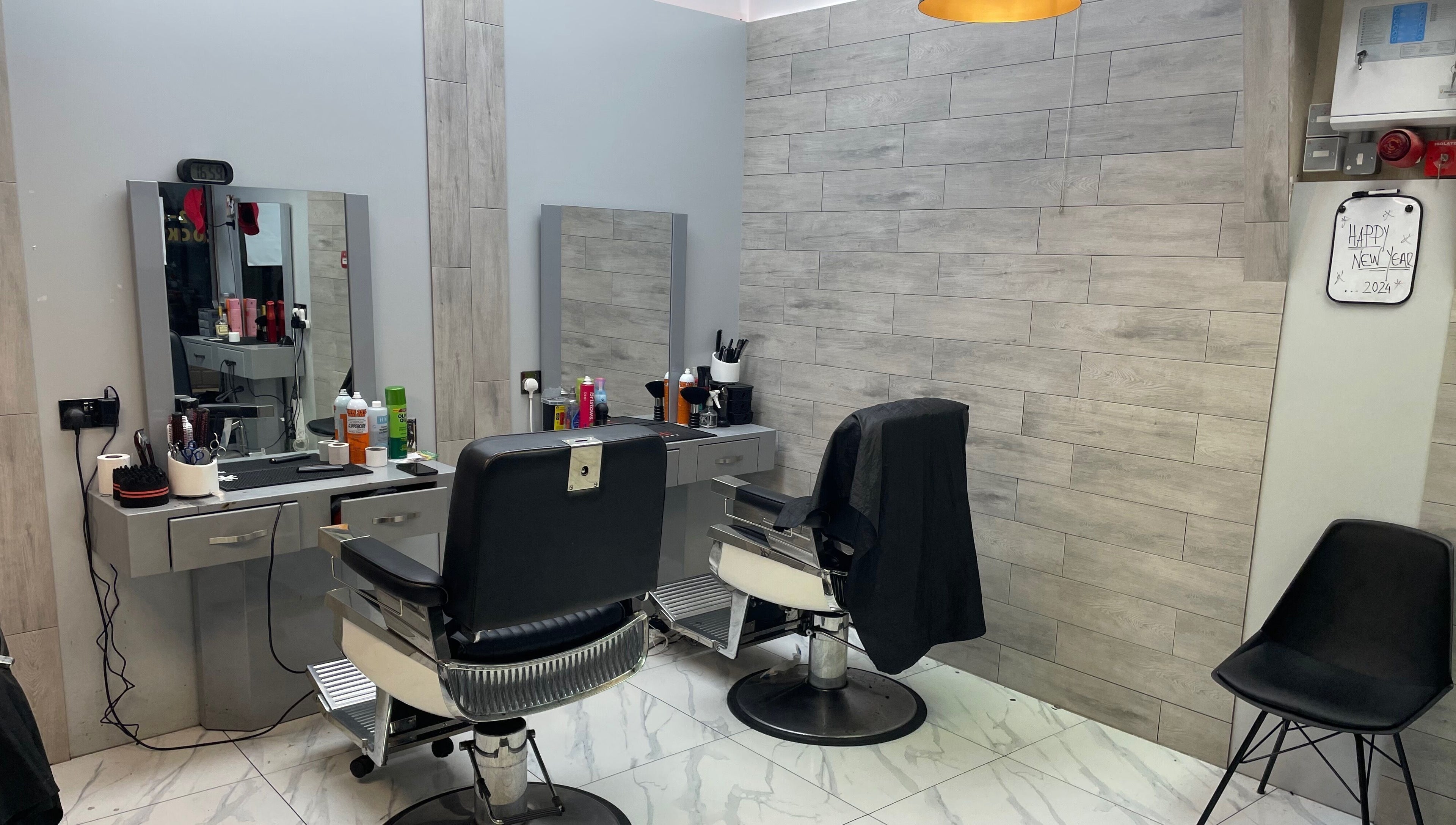 Modern salon chairs and styling stations at Lk Cutzz, Peterborough, England, GB. A sleek beauty experience.