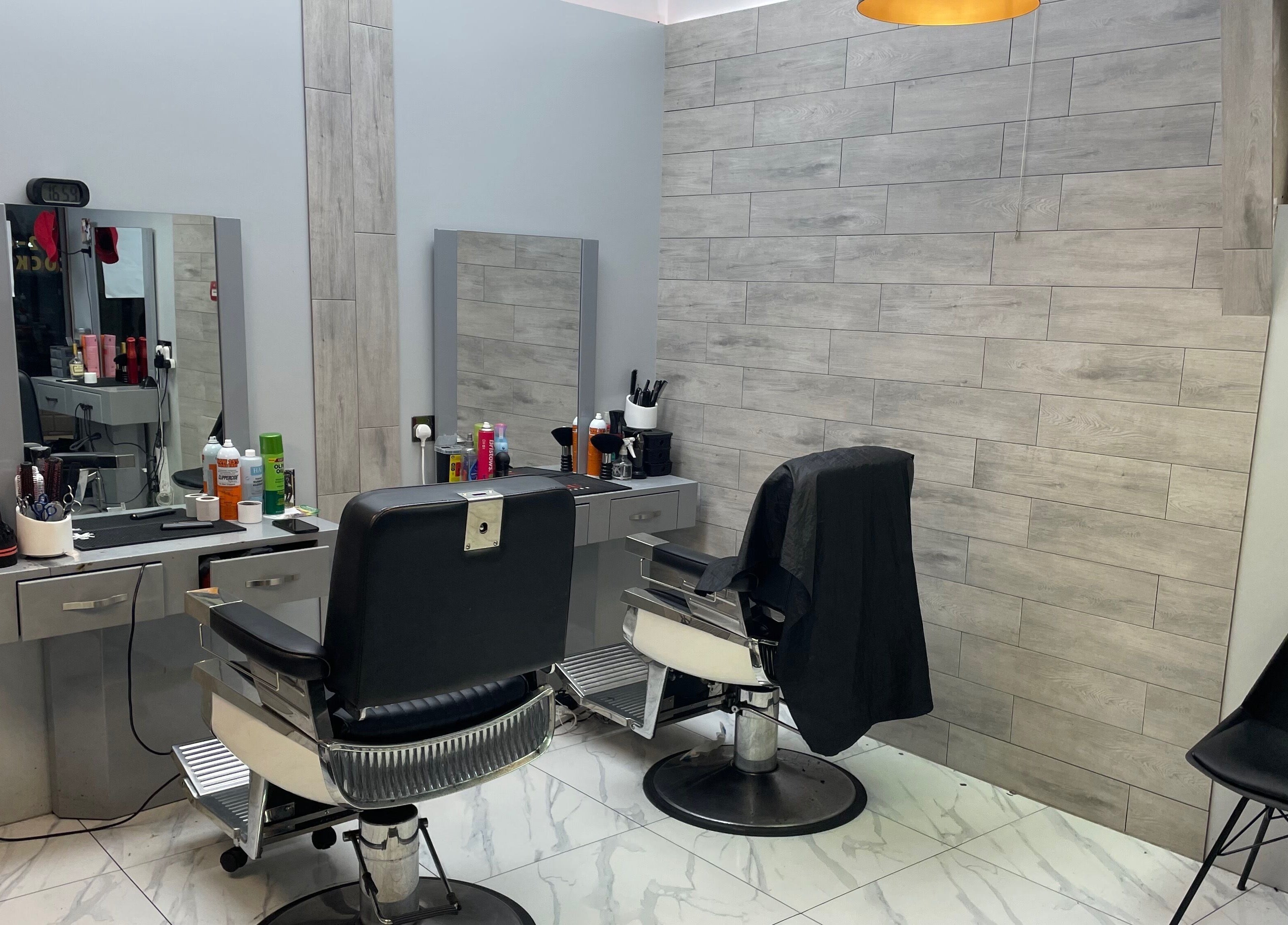 Modern salon chairs and styling stations at Lk Cutzz, Peterborough, England, GB. A sleek beauty experience.
