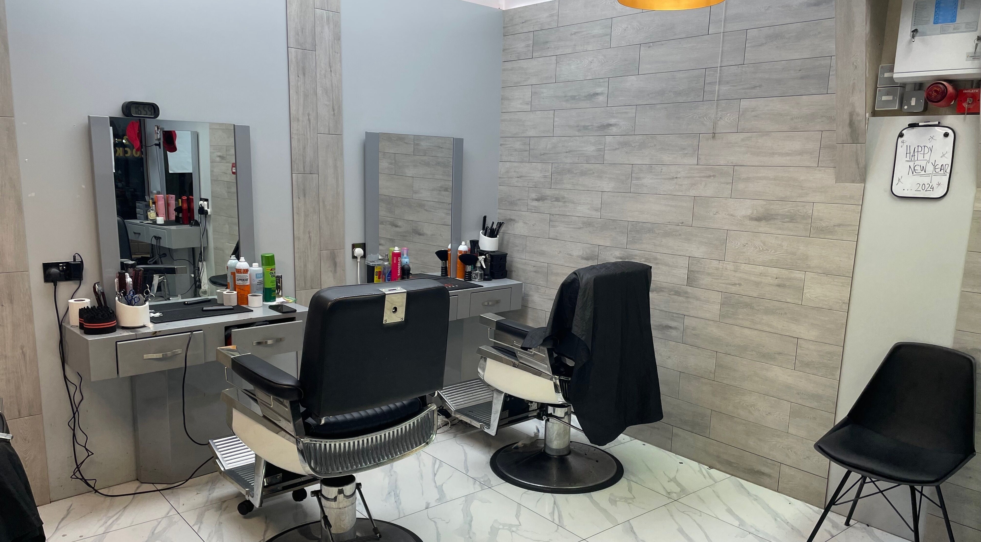 Modern salon chairs and styling stations at Lk Cutzz, Peterborough, England, GB. A sleek beauty experience.