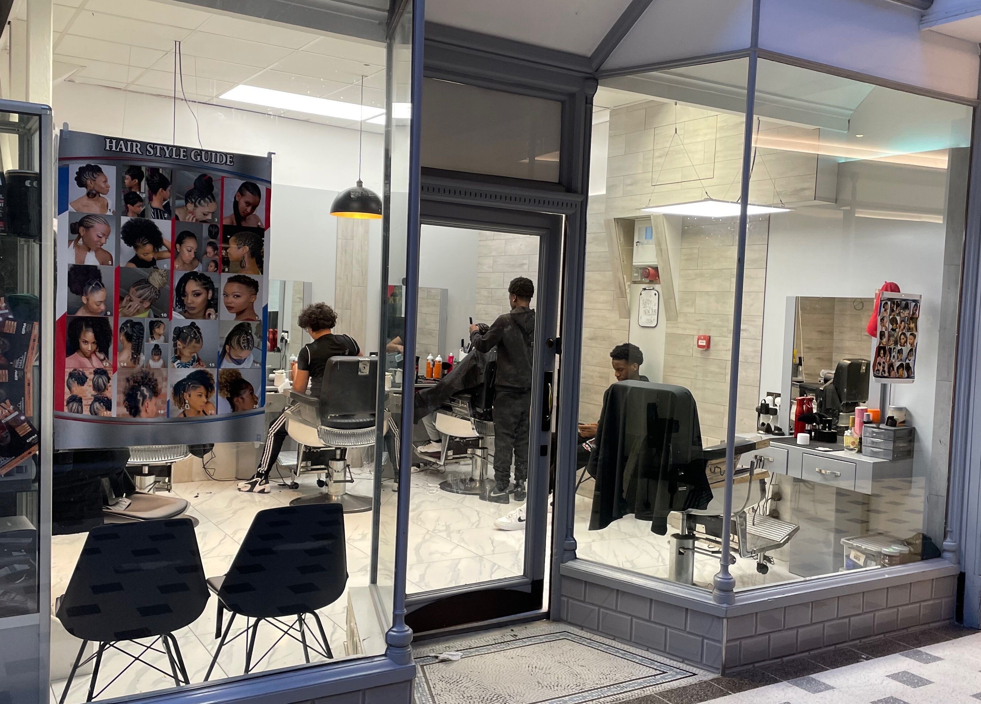 Lk Cutzz salon in Peterborough, England, GB, showcasing stylish barber setup with vibrant hair guides.