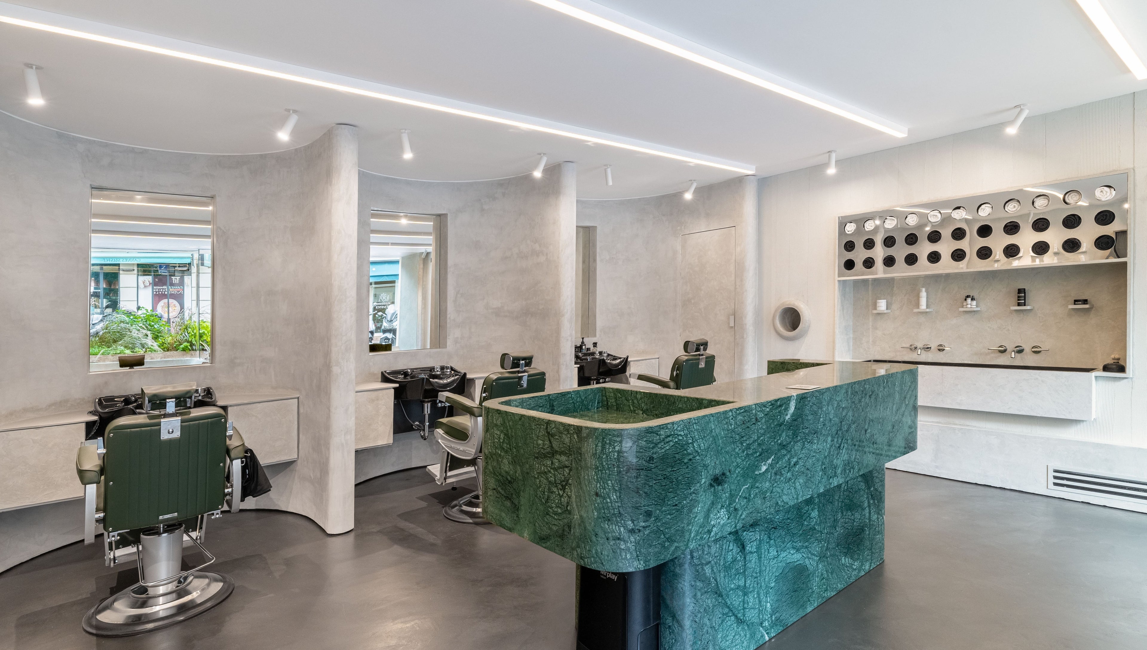 Modern interior of Melrose beauty salon in Cannes, Provence-alpes-côte D'azur, FR with green marble counter.