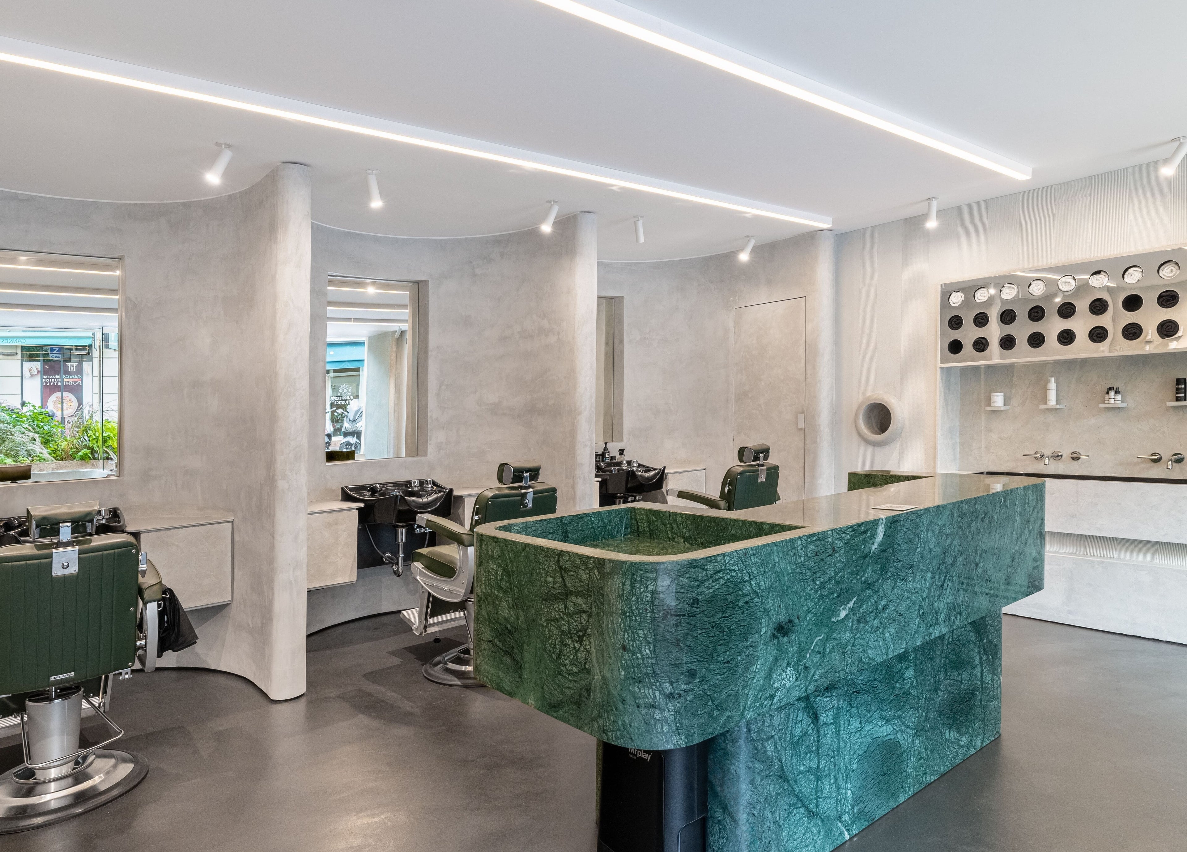 Modern interior of Melrose beauty salon in Cannes, Provence-alpes-côte D'azur, FR with green marble counter.