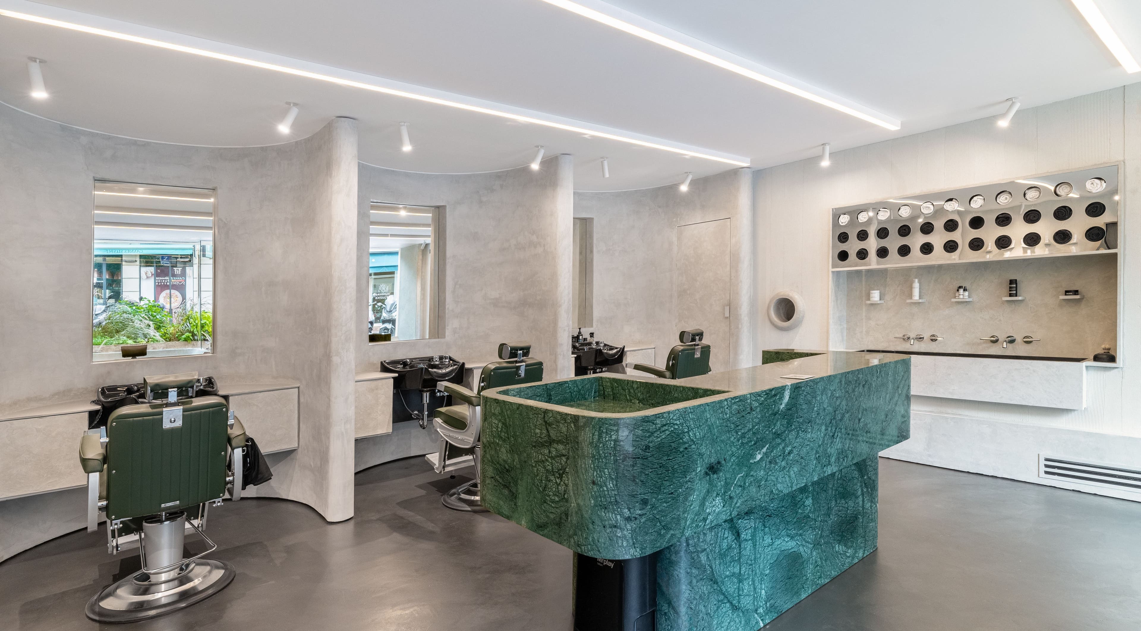 Modern interior of Melrose beauty salon in Cannes, Provence-alpes-côte D'azur, FR with green marble counter.