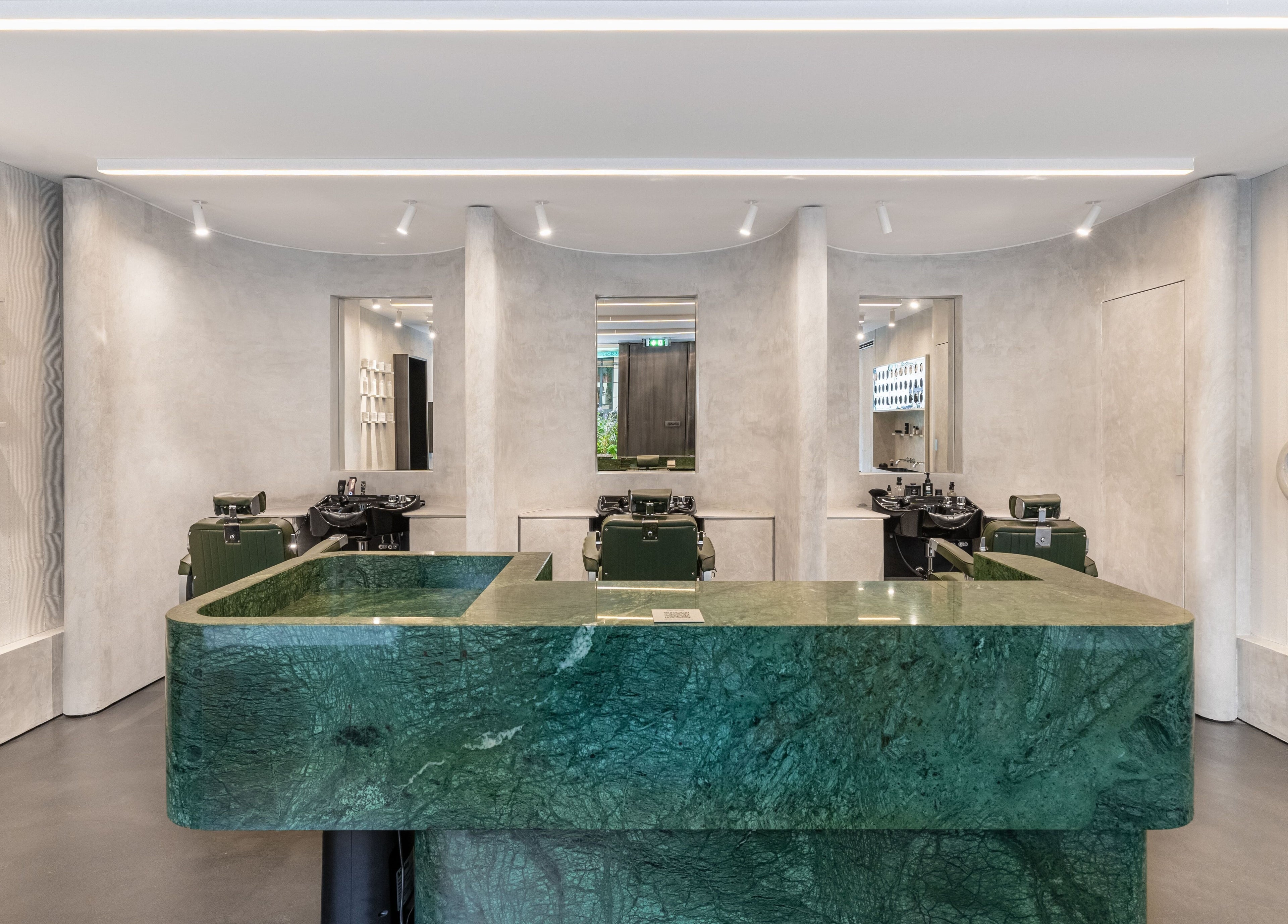 Modern salon interior at Melrose in Cannes, Provence-alpes-côte D'azur, FR, with green marble counter.