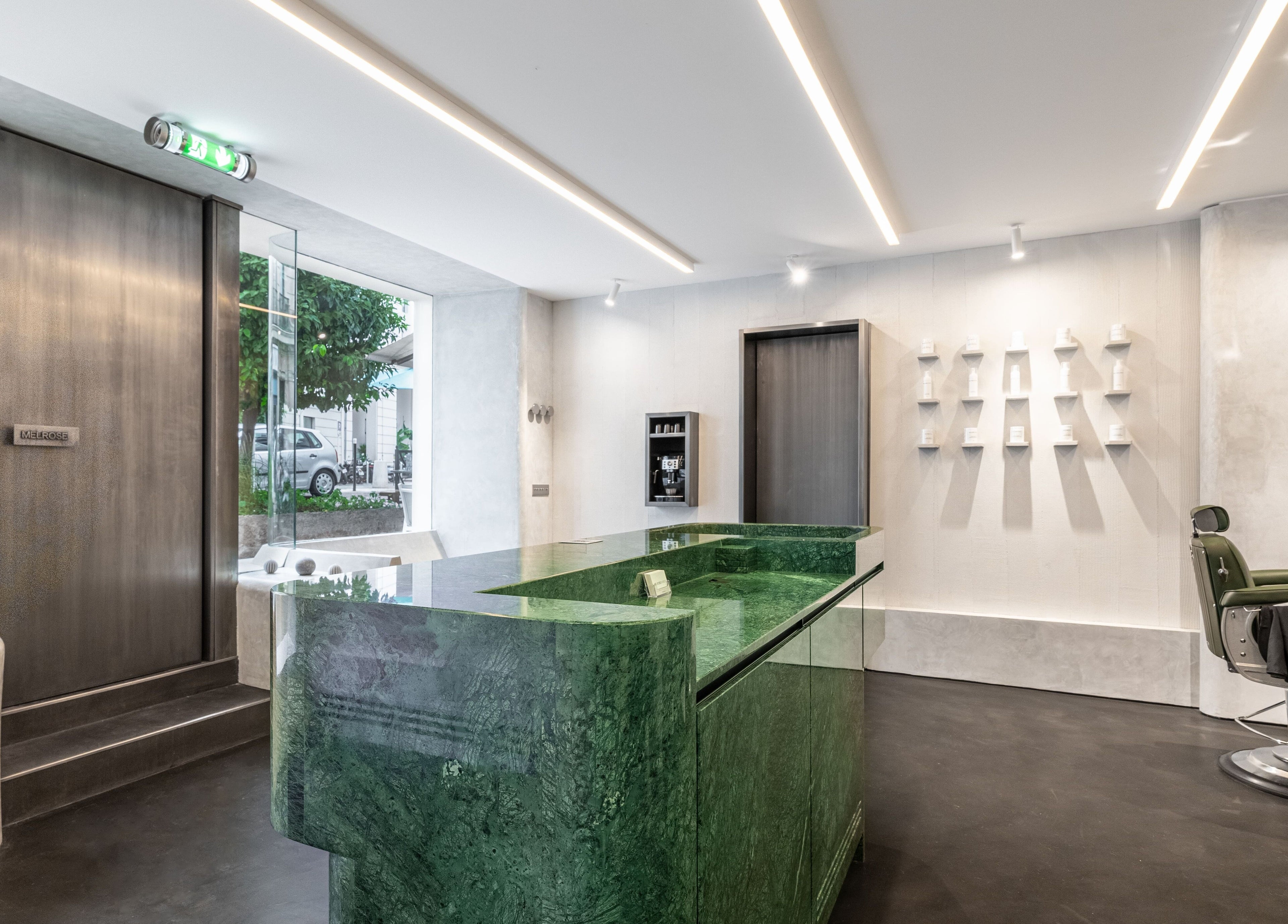 Modern interior of Melrose in Cannes, Provence-alpes-côte D'azur, FR showcasing a sleek green reception desk.