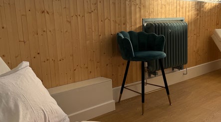 Chic seating at Jennifer Young Wellness Clinic, Madeley, England, GB. Inviting and serene interior design.