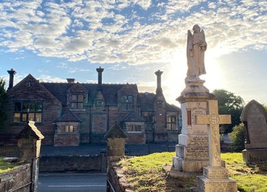 Historic building and monument at dawn near Jennifer Young Wellness Clinic, Madeley, England, GB.