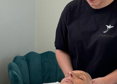 Facial massage at Jennifer Young Wellness Clinic in Madeley, England, GB providing relaxation and care.