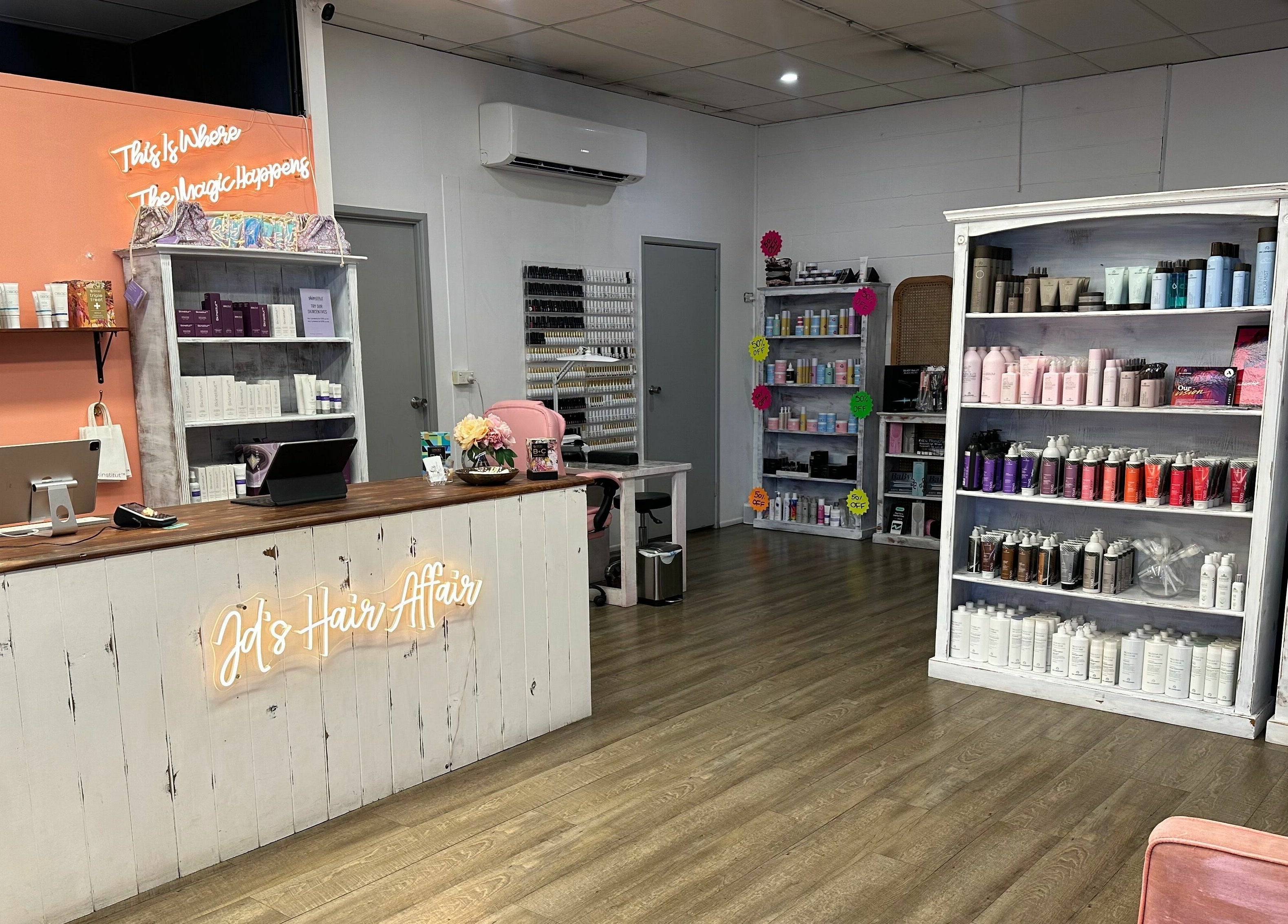 JD’s Hair Affair salon in Clermont, Queensland, AU featuring cozy decor and hair product shelves.