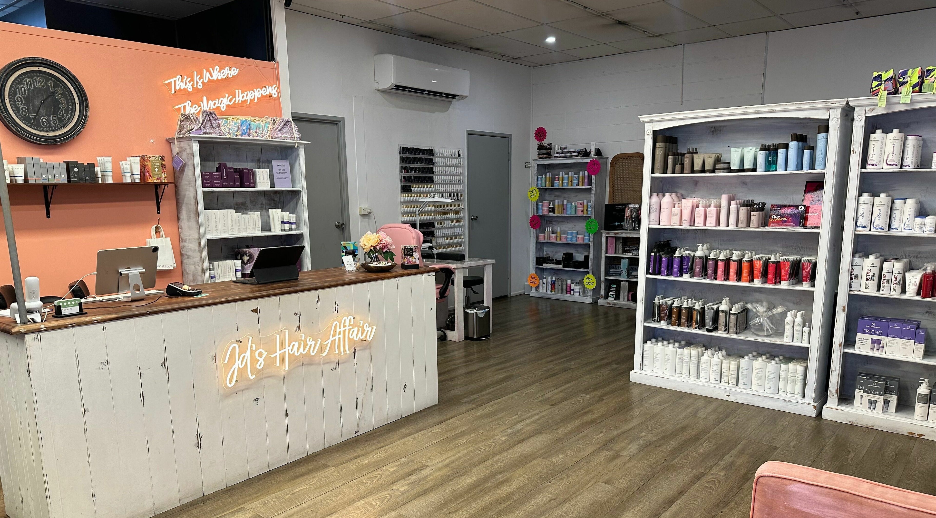 JD’s Hair Affair salon in Clermont, Queensland, AU featuring cozy decor and hair product shelves.
