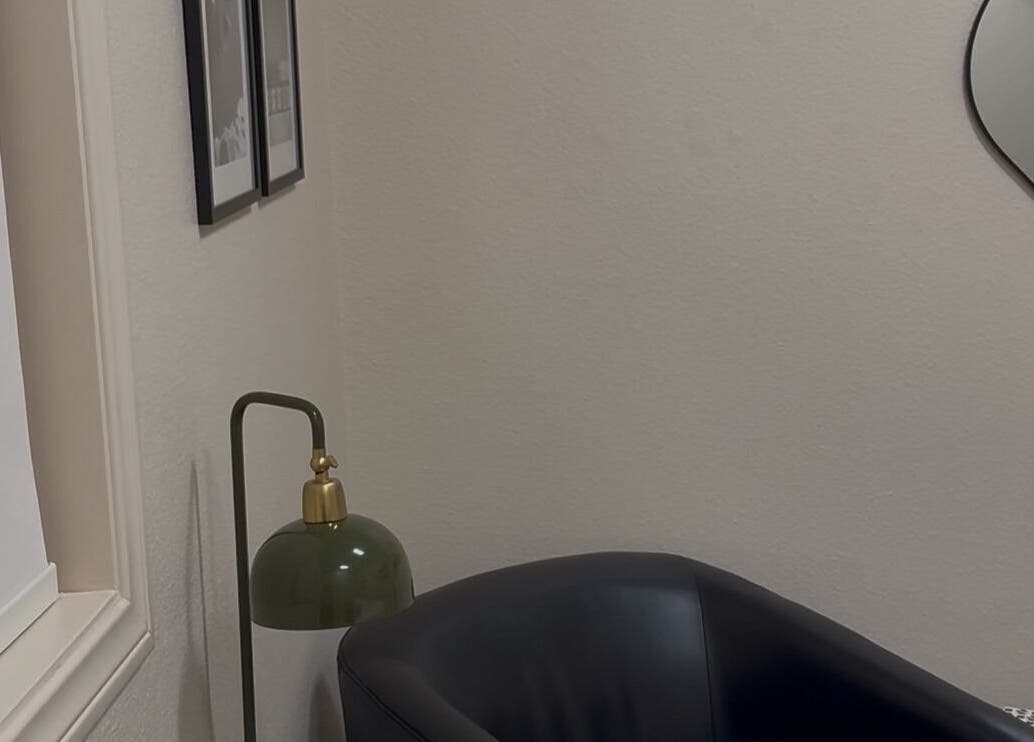 Cozy corner with chair and lamp at Blushed by Gaby, Palm Desert, California, US.